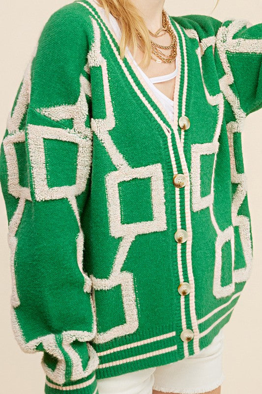 Introducing the Reina Cardigan, your go-to piece for effortless style. This slouchy and slightly oversized knit cardigan offers the perfect blend of comfort and fashion. With its drop shoulders design and soft, cozy fabrication, it's the ultimate throw-on-and-go essential. Embrace an easy and relaxed look while staying chic and comfortable with the Reina Cardigan.