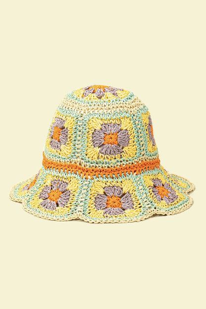 This artfully crafted bucket hat has a definite, vintage wow factor. created entirely of hand-crocheted paper. It has flower patterns all over the hat.  Made of 100% straw. Size adjuster inside. Can be folded very small to fit in your purse.
