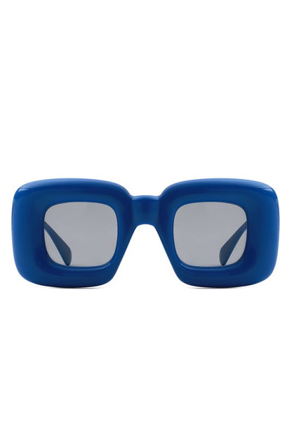 These Square Irregular Chic Chunky Fashion Sunglasses are sure to update your look this season. Sleek and stylish, they provide protection and shade from the sun's harsh rays. Their innovative design is perfect for adding a fashionable touch to any ensemble. blue