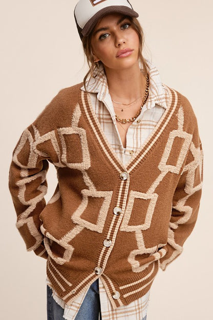 Introducing the Reina Cardigan, your go-to piece for effortless style. This slouchy and slightly oversized knit cardigan offers the perfect blend of comfort and fashion. With its drop shoulders design and soft, cozy fabrication, it's the ultimate throw-on-and-go essential. Embrace an easy and relaxed look while staying chic and comfortable with the Reina Cardigan.  brown