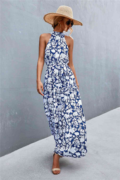 This Printed Sleeveless Tie Waist Maxi Dress is an ideal choice for both casual and formal occasions. Featuring a sleeveless design, the dress is perfect for wearing during the spring and summer months. However, it can also be layered for cooler weather in the fall and winter. Its flattering tie waist provides a stunning silhouette that you’ll love