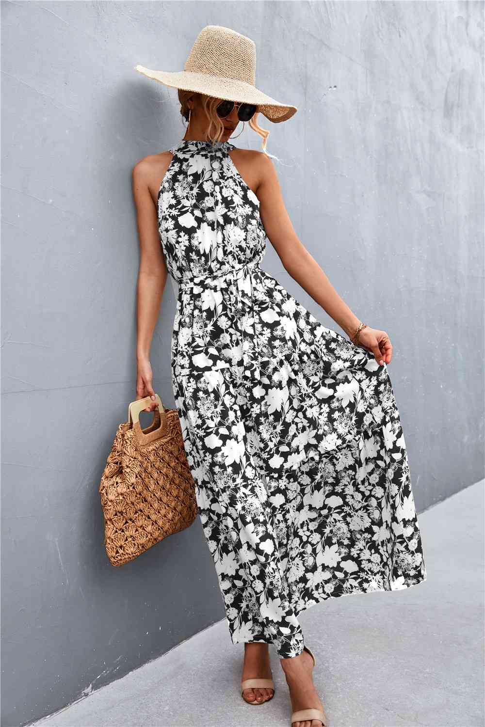 This Printed Sleeveless Tie Waist Maxi Dress is an ideal choice for both casual and formal occasions. Featuring a sleeveless design, the dress is perfect for wearing during the spring and summer months. However, it can also be layered for cooler weather in the fall and winter. Its flattering tie waist provides a stunning silhouette that you’ll love