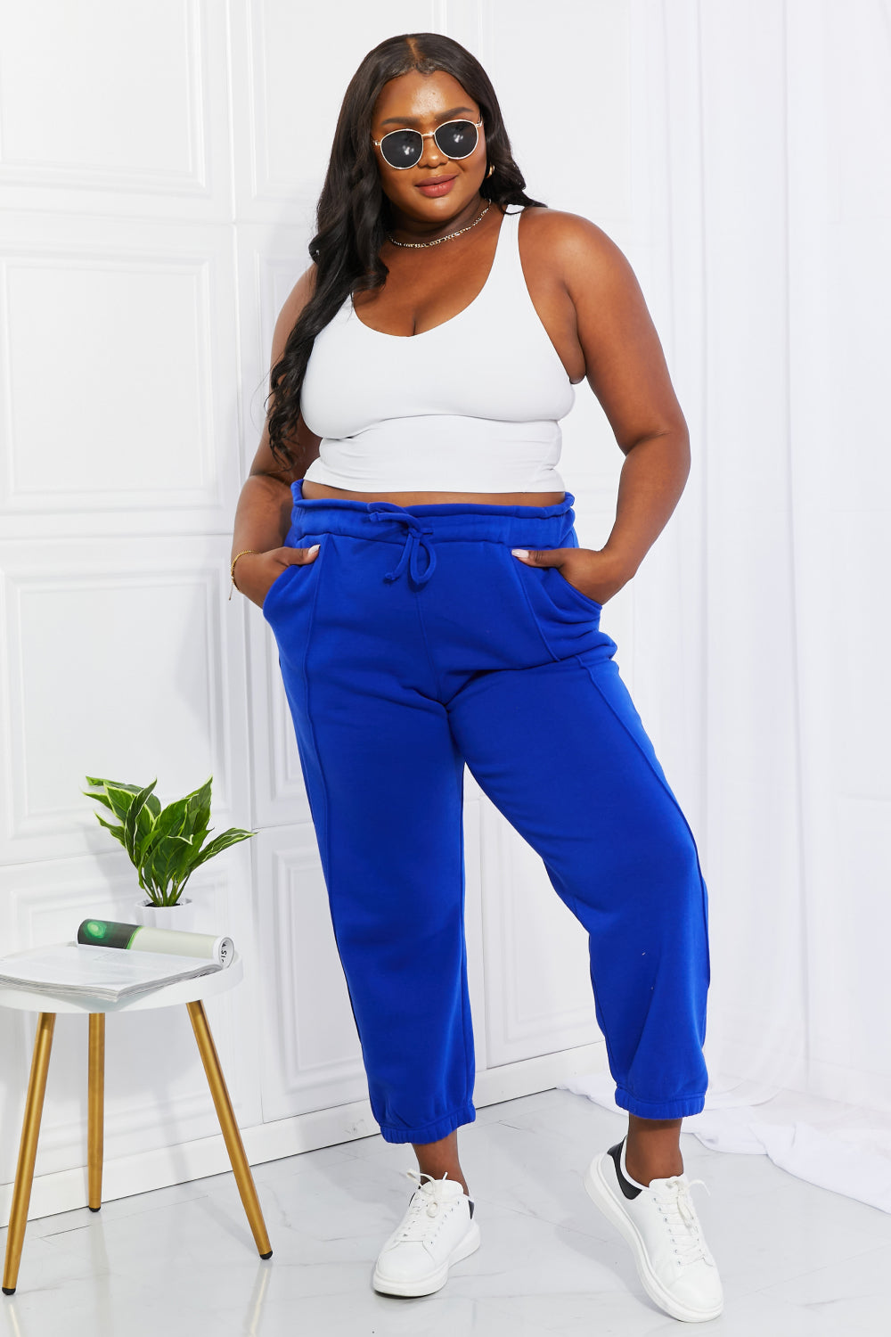 happy size. plus size. full figured. joggers with pockets. Give your favorite joggers a makeover by adding a paperbag waist detail. In a bold and beautiful blue, these comfy joggers feature a high waist and elasticized hems. 