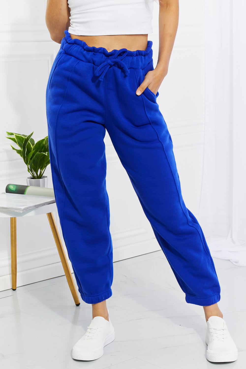 joggers with pockets. Give your favorite joggers a makeover by adding a paperbag waist detail. In a bold and beautiful blue, these comfy joggers feature a high waist and elasticized hems. 