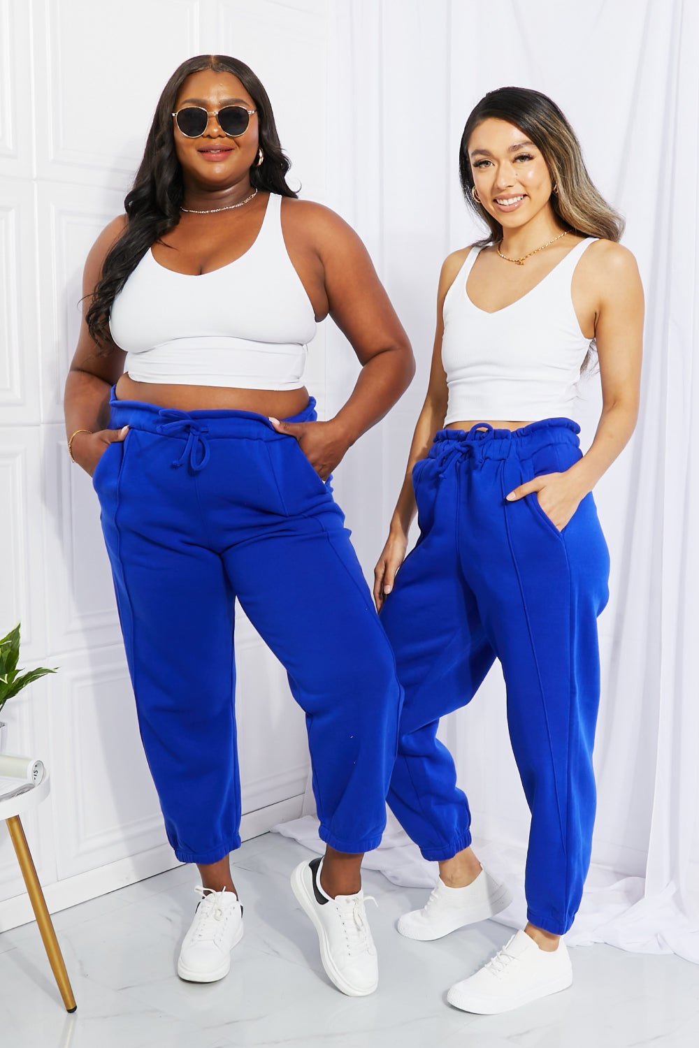happy size. plus size. full figured. joggers with pockets. Give your favorite joggers a makeover by adding a paperbag waist detail. In a bold and beautiful blue, these comfy joggers feature a high waist and elasticized hems. 